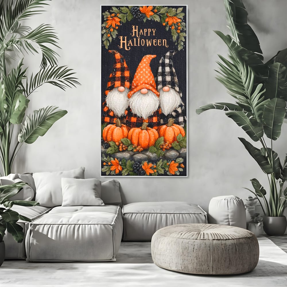 Tablou canvas cu ilustratie cu trei gnomi de halloween, in rama de aluminiu argintiu, pe perete intr-un living